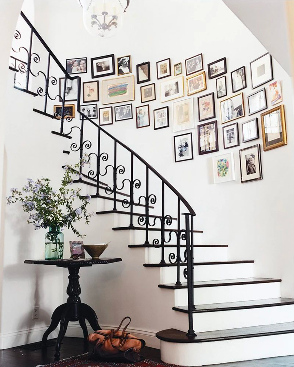 Hanging pictures around spiral stairs