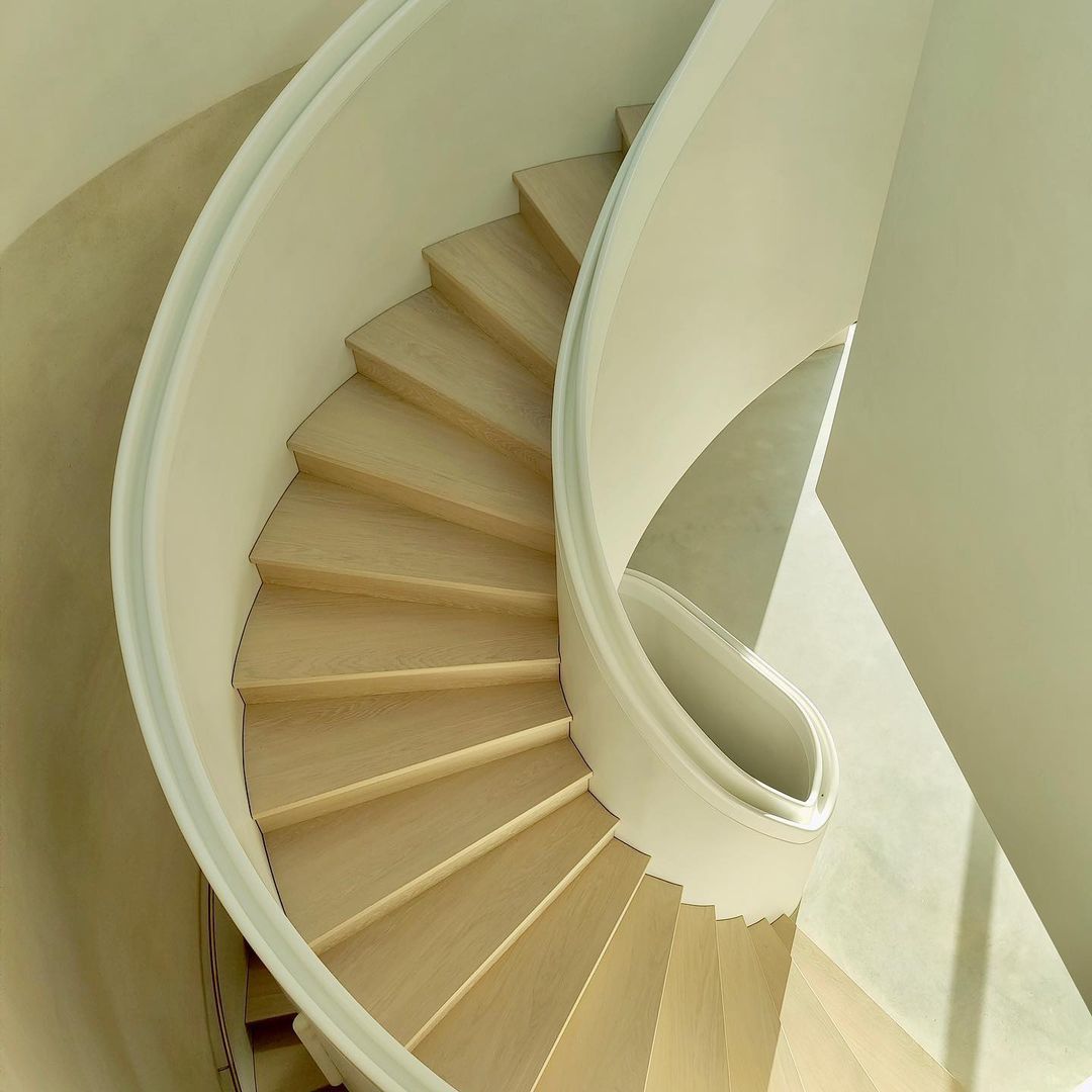Aerial view of sweeping helical staircase at luxury residential property