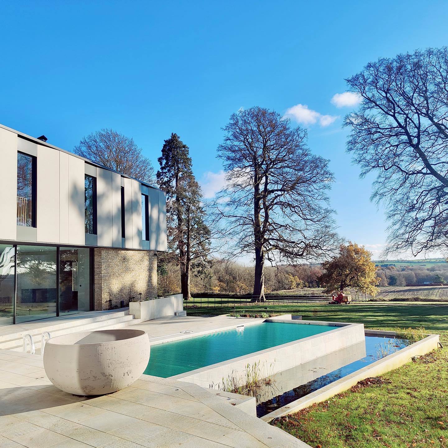 Rear view showing swimming pool of luxury new build development